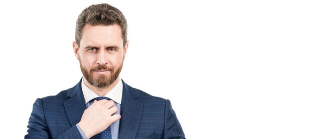 Portrait of professional man businessman with serious face adjusting necktie in formal suit boss Man face portrait banner with copy space Business man in suit isolated studio background