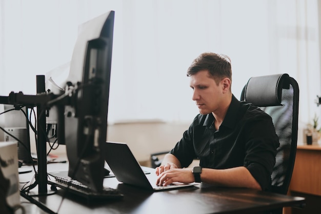 Portrait professional man programmer working concentrated on computer in diverse offices Modern IT technologies development of artificial intelligence programs applications and video games concept