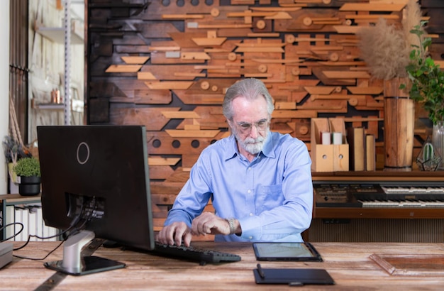 Portrait of professional senior businessmen working on desktop in a modern office room