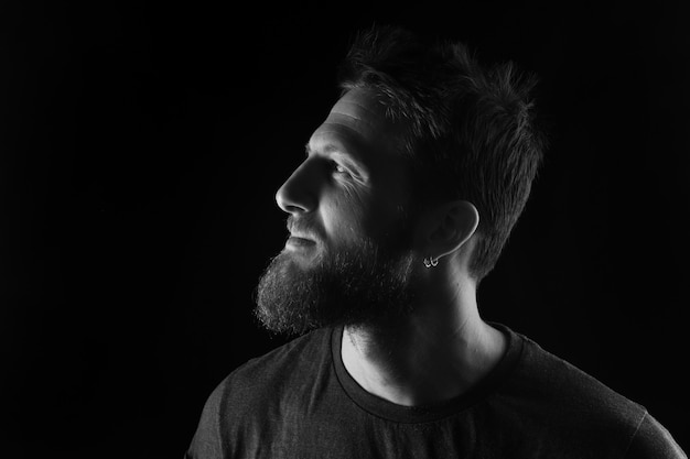 Portrait of profile of a man on black ,black and white