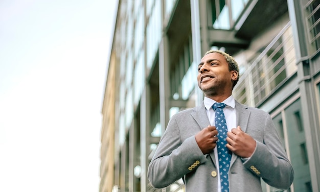 Portrait of a proud businessman, low angle view