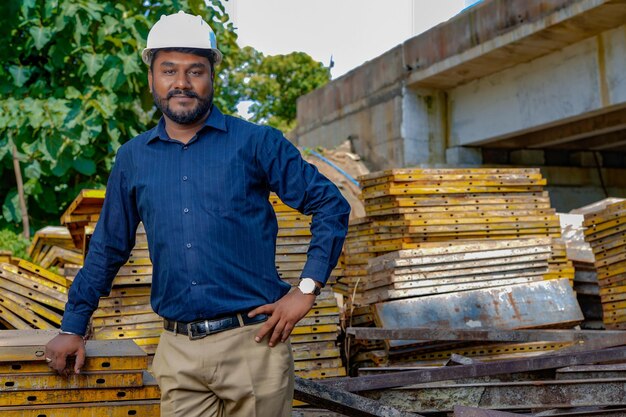 Portrait of a proud Indian engineer posing looking at the camera