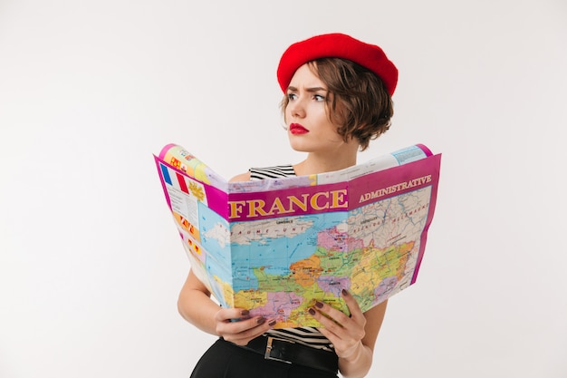 Portrait of a puzzled woman wearing red beret