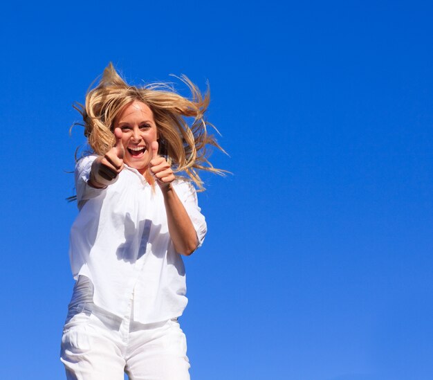 Portrait of an radiant woman jumping in the air outdoor 