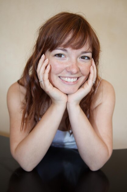 Portrait of red hair beautiful woman looking at camera