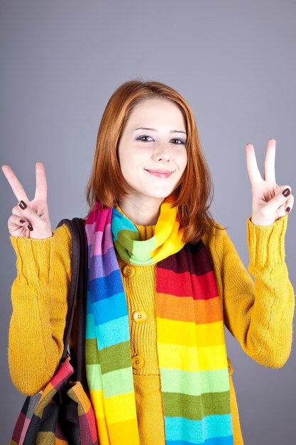 Portrait of red-haired girl in scarf.