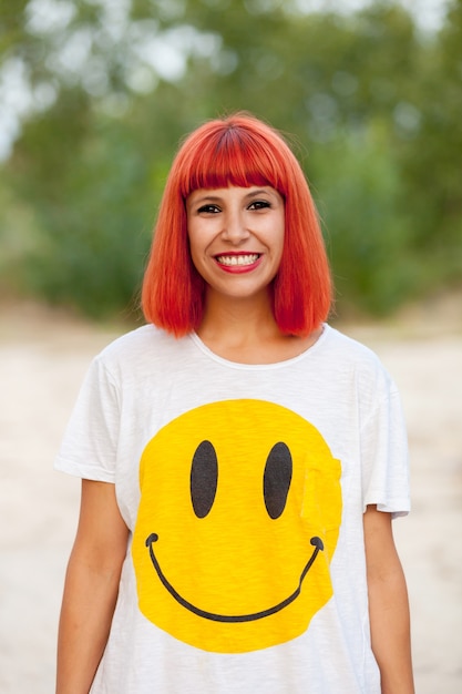 Photo portrait of red haired woman with a funny shirt