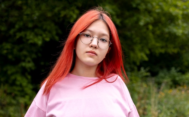 Portrait of redhead girl outdoors