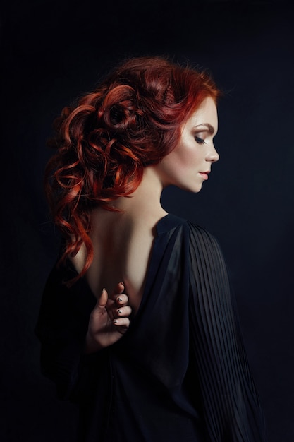 Portrait of redhead sexy woman with long hair 