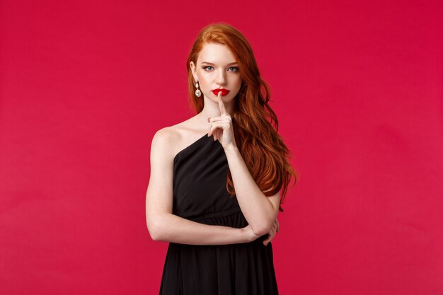 Portrait of a redhead woman in black dress