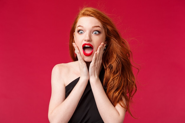 Portrait of a redhead woman in black dress