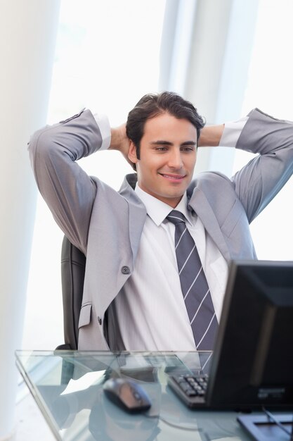 Portrait of a relaxed businessman working with a computer