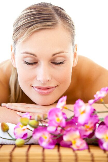 Portrait of a relaxed woman lying on a massage table 