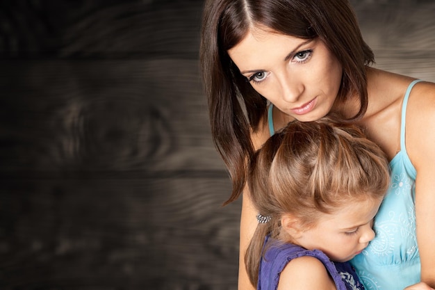 Portrait  of sad Mother with daughter