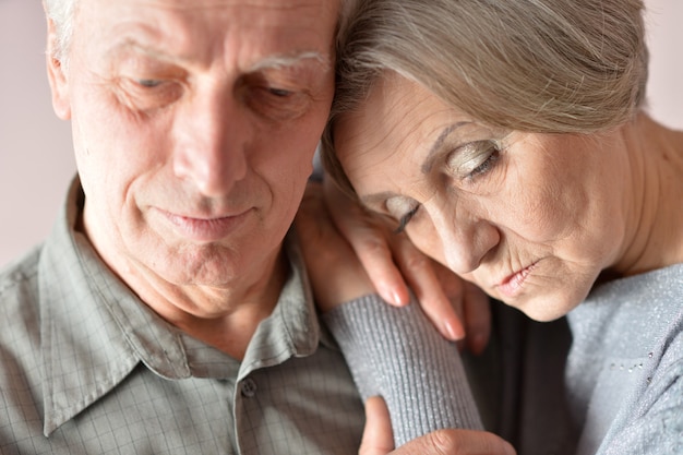 Portrait of  sad senior couple close up