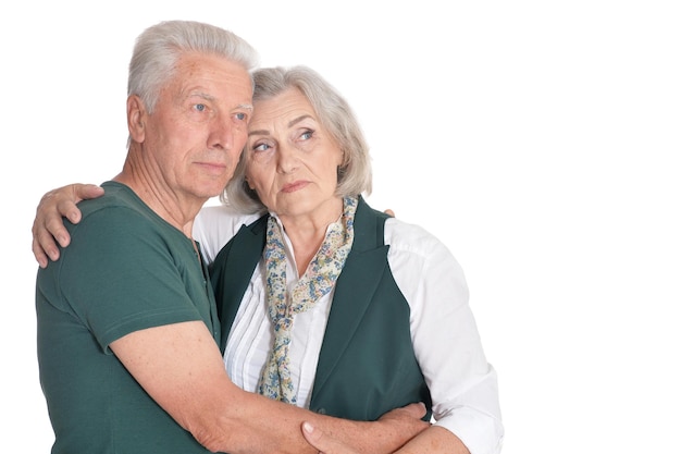 Portrait of sad senior couple isolated on white background