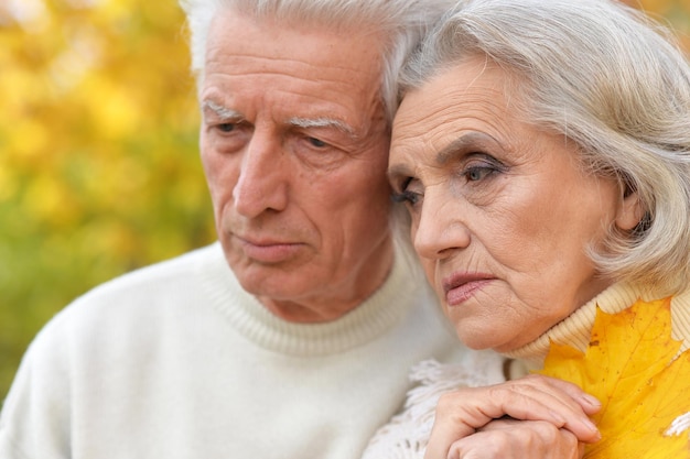 Portrait of a sad senior couple outdoors