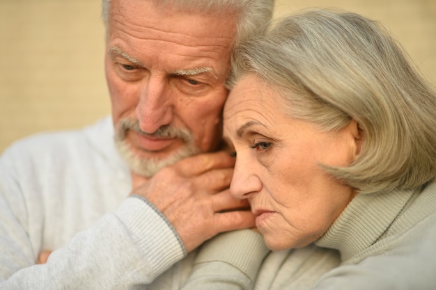 portrait of Sad senior couple in  park