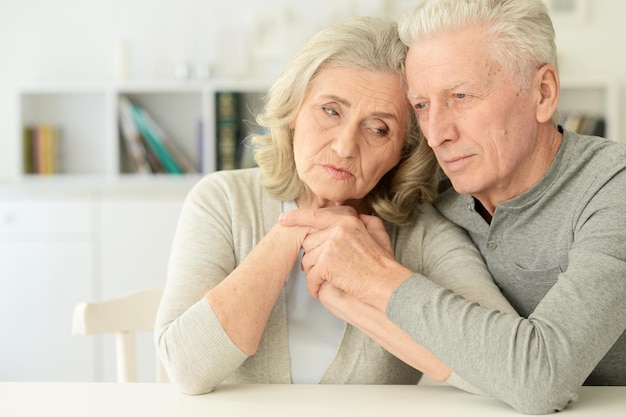 Portrait of a sad senior couple posing