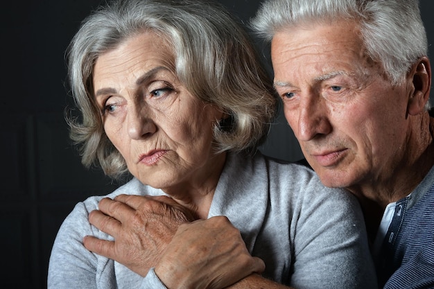 Portrait of sad senior couple