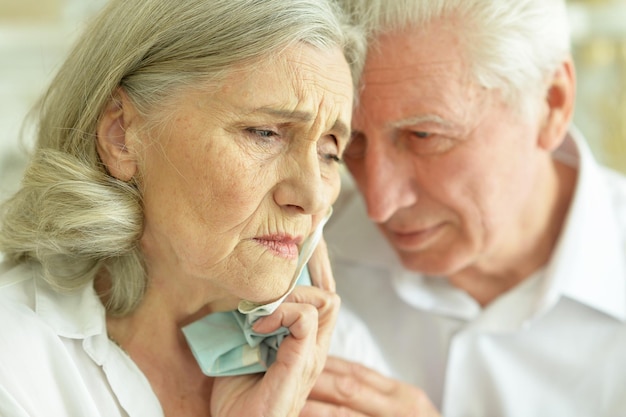 Portrait of sad senior couple