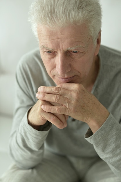 Portrait of Sad senior man at home