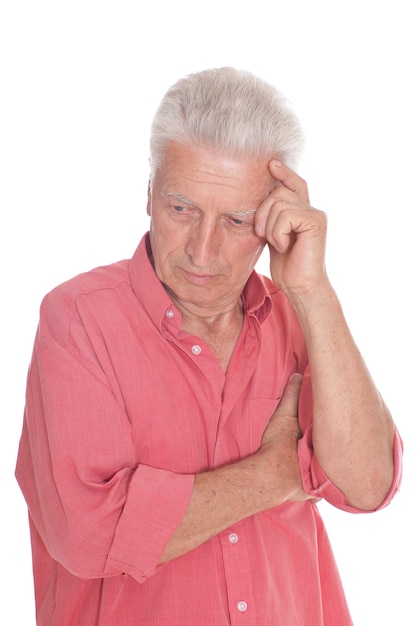 Portrait of sad senior man with headache isolated