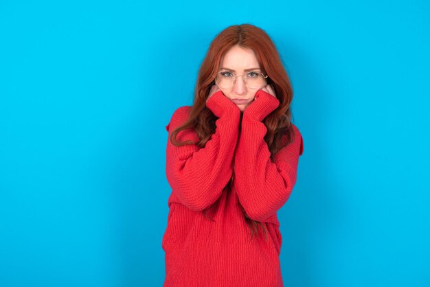 Portrait of sad woman hands face