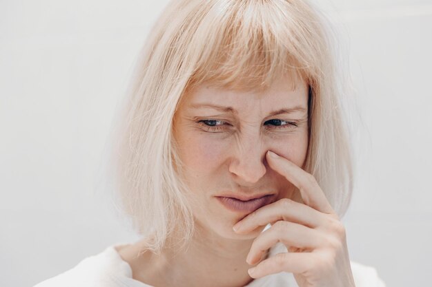 Portrait of a sad woman on a white background