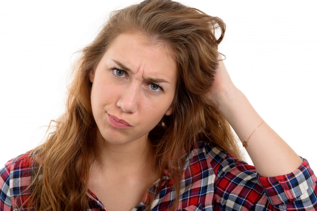 Photo portrait of a sad young woman, on white