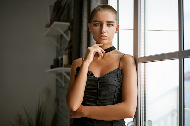 Portrait of a sad young woman with short hair