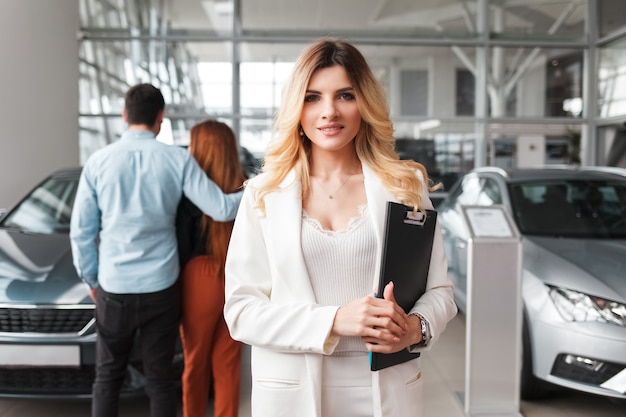 Portrait of a saleswoman car dealership