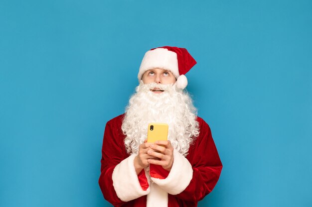 Portrait of Santa Claus with phone