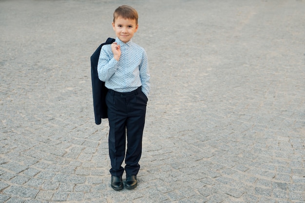 Portrait school boy posing in elegant clothes