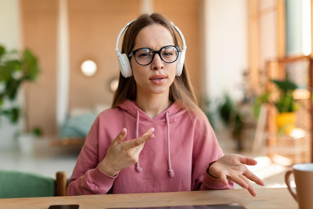 Photo portrait of schoolgirl learning distantly during virtual remote class participating in online lesson webcam pov