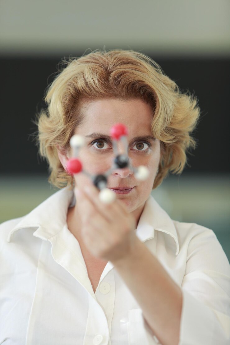 Photo portrait of scientist holding molecule in laboratory