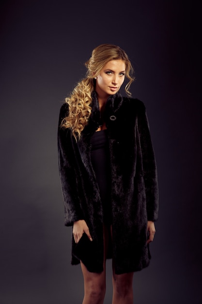 Portrait of a seductive lady in fur coat