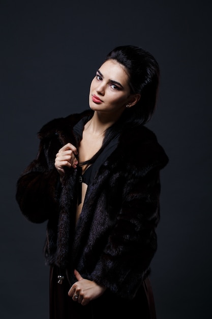 Portrait of a seductive lady in fur coat