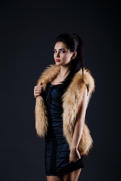 Portrait of a seductive lady in fur coat