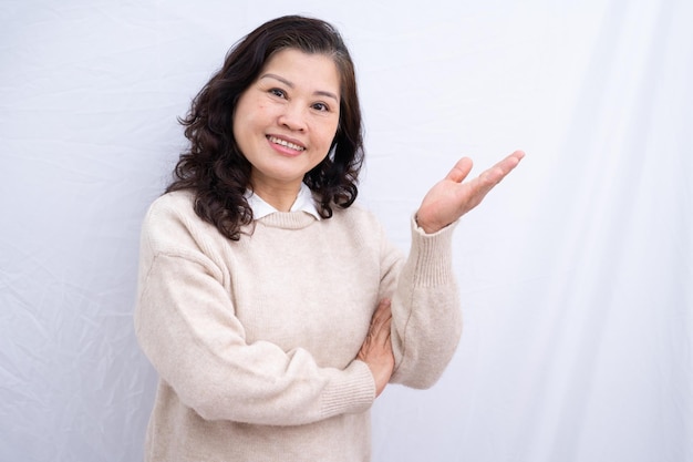 Portrait of senior Asian woman on white background