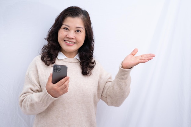 Portrait of senior Asian woman on white background