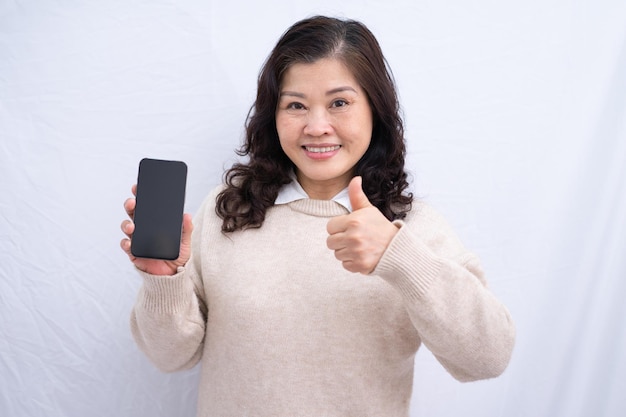 Portrait of senior Asian woman on white background