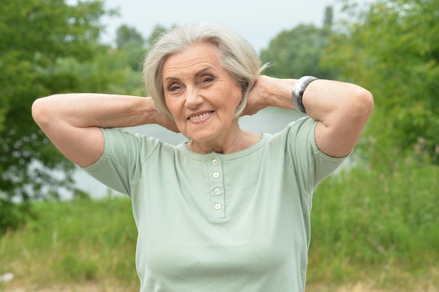 Portrait of senior beautiful woman in spring park