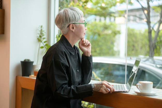 Portrait of senior businesswoman in coffee shop