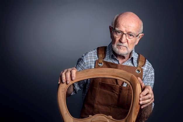 Portrait of senior caucasian craftsman 