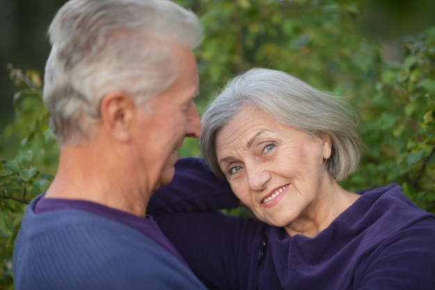 portrait of a senior couple in autumn park