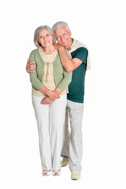 Portrait of senior couple embracing isolated