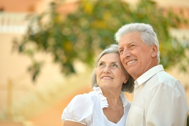 Portrait of a senior couple relaxing near  hotel resort