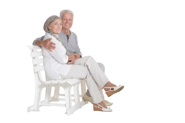 Portrait of senior couple sitting on bench