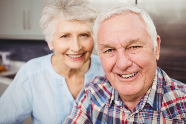 Portrait of senior couple smiling at home